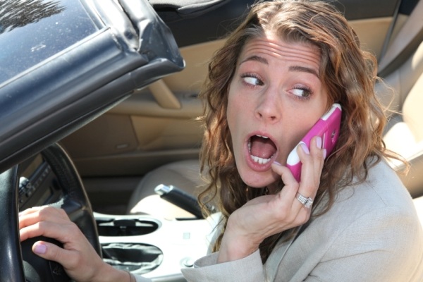 Woman driver talking on cellphone